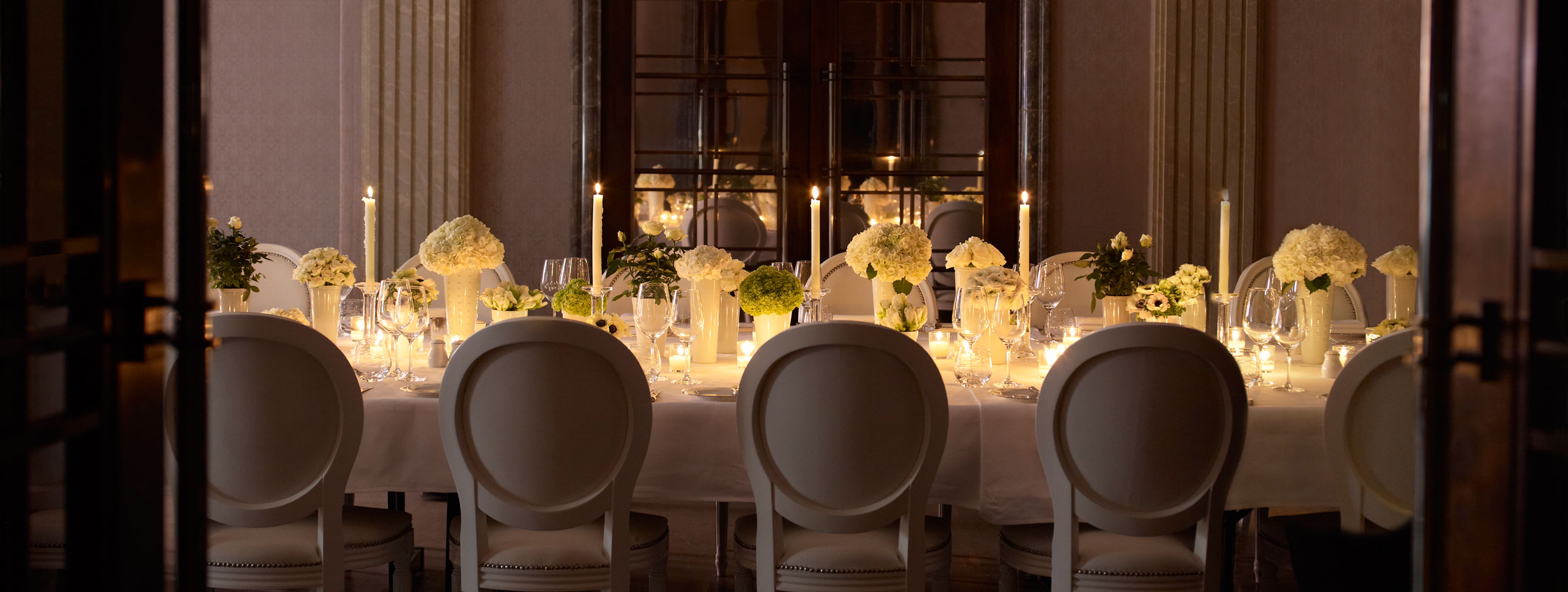 An all white set dinner table