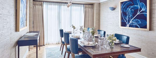 The Apartment at The Connaught dining table set up with tableware and chairs around